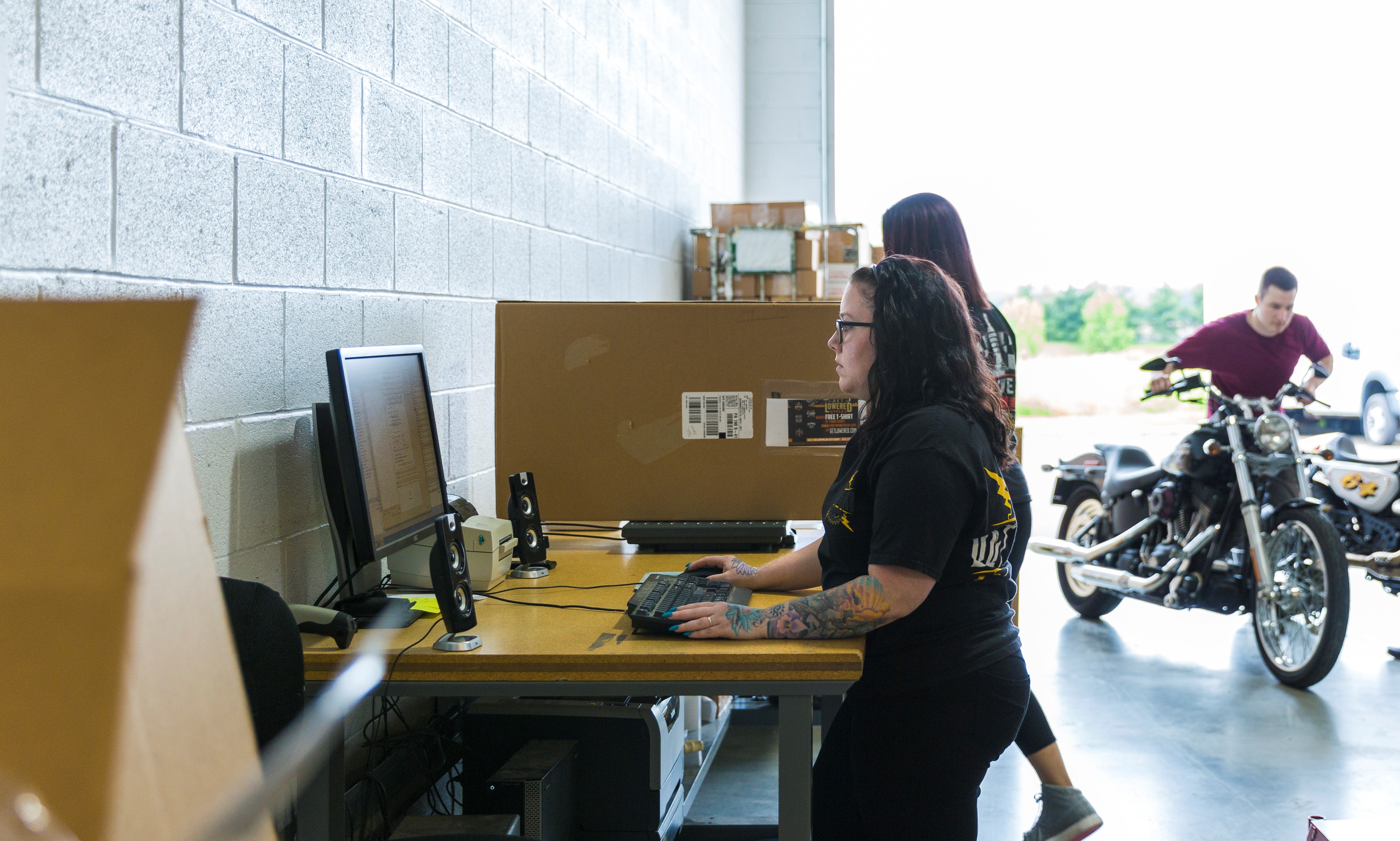 Woman standing at a computer