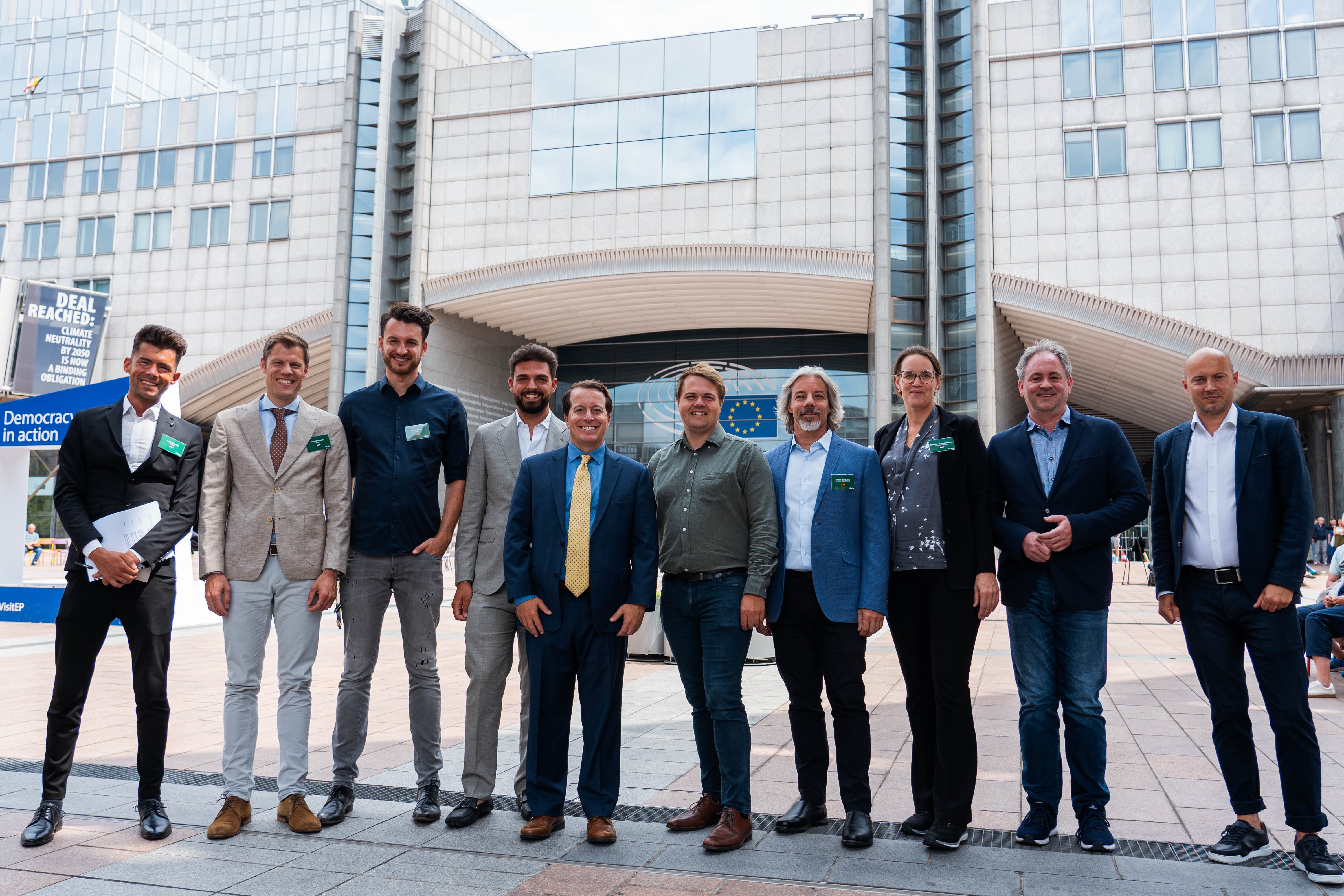 eBay CEO Jamie Iannone and visiting sellers in front of the EU Parliament at eBay's 2023 Brussels Seller Advocacy Day